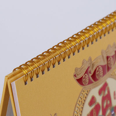 Selo quente espiral clássico bonito da folha do material e do ouro do papel de arte do calendário de mesa